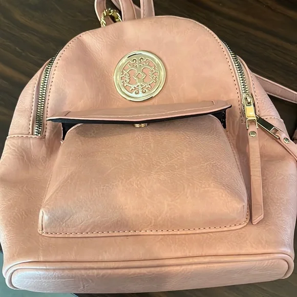 Womens Sam and Hadley backpack Peach with gold emblem and